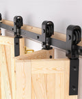Close-up of a 52 Inch Bifold Barn Door Hardware Kit For 4 Bifold Doors Black Finish Folding Push Pull System installation