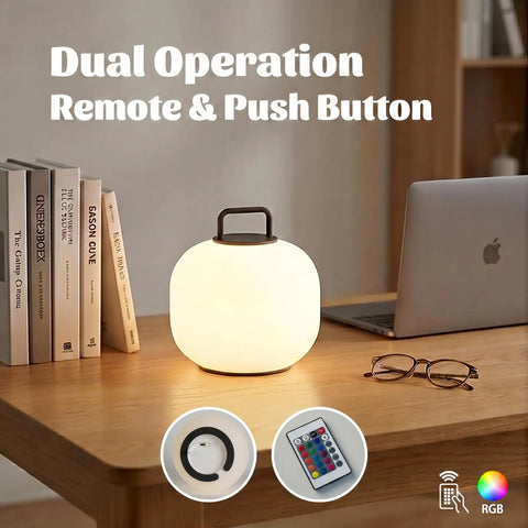 Cordless RGBW LED Table Lamp With Remote Control, Portable Outdoor Lantern on desk with books, laptop, and glasses.