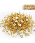 Reliable Heavy Duty Gold Thumb Tacks Boss Level Needlepoint Push Pins For Walls And Cork Boards Gonna Stay Put Without Bending Premium Steel Home Decor Fixtures in a pile with a storage container