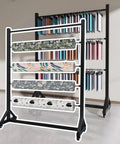 Badass Heavy Duty Rolling Textile Storage Rack With Adjustable Metal Rods And Smooth Casters For Vinyl Rolls Wallpaper Window Film Scarves And Big Quilts 6 Bar Setup displaying various wallpaper and fabric rolls.