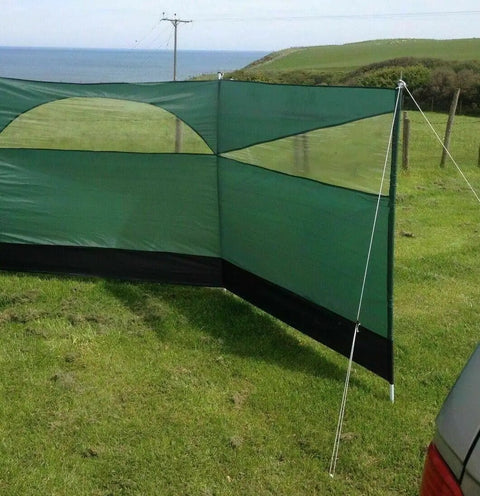 Forest Green 5 Panel Wind Privacy Screen Windbreaker for Camping, Garden or Beach, set up outdoors with guy lines and steel pegs
