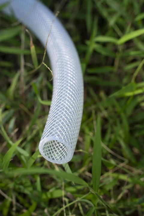 Three Quarter Inch ID By One Inch OD High Pressure Braided Clear PVC Tubing Ten Foot Heavy Duty Flexible Vinyl Hose in grass