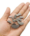 Hand holding semicircle woodruff keys from Garage Grade 75 Piece Woodruff Key Set With 15 Sizes Semicircle Half Moon Keyways For Shafts And Cranks In Automotive And Industrial Machinery Tools Carbon Steel Corrosion Resistant 5 Of Each Size Pack