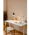 Home study area with a Modern Periodic Table Of Elements Wall Chart Educational Poster For Students on a desk