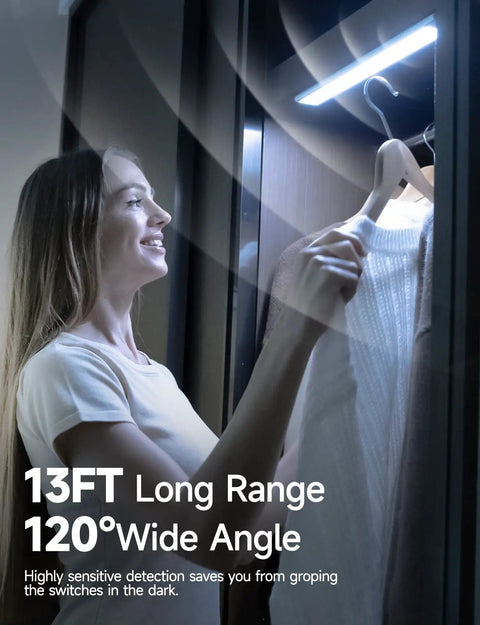 Person using Rechargeable Under Cabinet Lights With 40 LEDs, Wireless Motion Sensor, 8000K Cool White in closet.