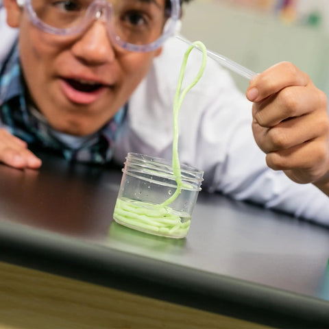 Color Chemistry Lab Kit For Kids Kid Friendly Safe Mess Free Experiments Build Color Mixing Skills Hands On STEM Activity Set For Young Scientists Fun Home Learning Project That Sparks Creativity And Curiosity. child using dropper with green liquid in small jar