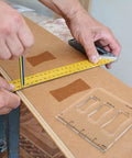 Measuring wood with ruler while using Badass Butterfly Router Template Set For Woodworking Featuring Slick Bowtie Jig Kit.