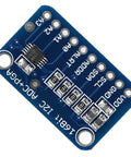 Sixteen Bit I2C Analog To Digital Converter Development Board With Programmable Gain Amplifier and ADC Module, blue circuit board.