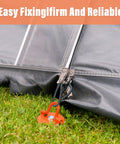 Tent secured with Heavy Duty Screw In Ground Anchors Kit With Metal Spiral Earth Stakes Folding Ring Design, visible on grass, orange.