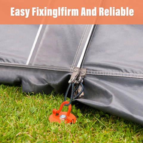 Tent secured with Heavy Duty Screw In Ground Anchors Kit With Metal Spiral Earth Stakes Folding Ring Design, visible on grass, orange.