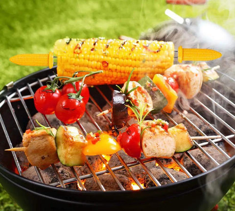Grilling corn with 10 Piece Stainless Steel Corn Holders Set For Corn On The Cob Twin Prong Skewers on a BBQ grill.