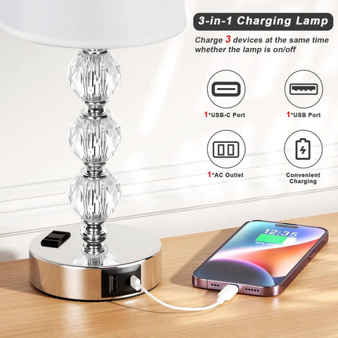 Crystal Table Lamp Set of 2 With USB A and USB C Ports and 2 Pin Outlet, charging phone on wooden table, 14.6 inch tall.