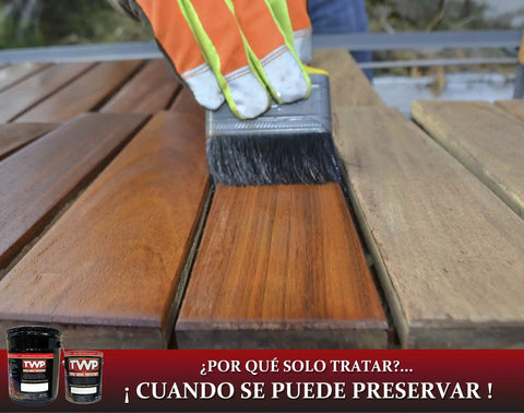 Applying Heavy Hitter Oil Based Wood Preservative And Exterior Stain In Warm Pecan Hue to wooden planks with a brush.