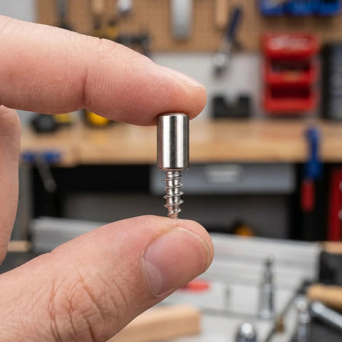 Close-up of Heavy Duty Cabinet Shelf Pins Kit for Kitchen Cupboard 150 Self Tapping Peg with sleeve in hand