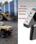 Toyota Land Cruiser 1 Twelfth Scale RC Crawler Truck beside a control remote with labeled functions.