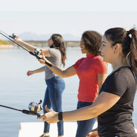 Group using Go-To Spincast Reel And Telescopic Fishing Rod Combo with Extendable 22.5-Inch To 6-Foot E-Glass Pole at a lake.