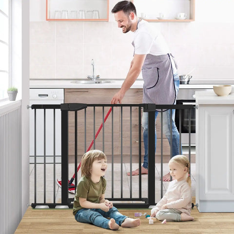 Extra Wide Baby Gate For Doorways 29.93 To 51.5 Inches, 30-Inch High, black, installed in kitchen with children playing