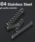 Assorted Compression Springs Kit 0.3mm Wire 2mm and 4mm OD 5 to 25mm Length 600 Pcs 304 Stainless Steel on black surface