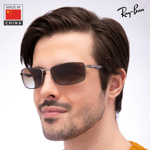 Man wearing polarized rectangle shape sunglasses for men with grey gradient brown lenses street ready modern edge frame everyday wear that slays formal and casual styles includes eyewear kit.