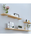 Built Like A Tank Hidden Floating Shelf Brackets 2 Or 4 Pack showcasing wooden shelves with plants and decor items.