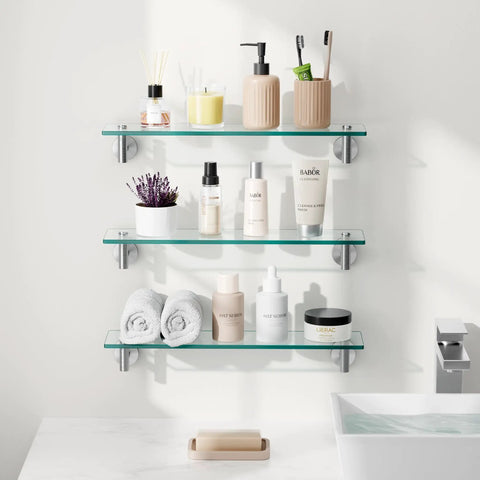 Sturdy 20 Inch Glass Wall Shelves 3 Pack With Rectangular Stainless Steel Brackets In Brushed Finish mounted with toiletries