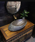 USZWBY Bathroom Sink Creativity Ceramic Vessel Sink Stone Texture Bathroom Sink with unique oval shape on wooden countertop.