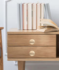 Gold Zinc Alloy Cabinet Pull Handle, Single Hole Door Pull For Wardrobe And Drawer on wooden drawer with books
