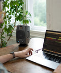 D3V Active Desktop Monitoring System Pair With USB C Connection for desktop studio use on desk with plant and laptop