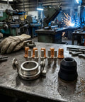 Tough As Nails 12 Piece Plasma Torch Parts Kit Featuring Copper Alignment Nozzles Secure Socket Electrodes Quick Fit Caps and Precision Circle Guides detailed on a workbench.
