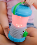 Child holding Durable Light And Sound Camping Lantern Toy With Six Color Modes and Cool Sound Effects for Kids, pink light mode