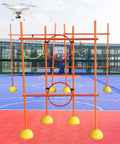 Ultimate Drone Racing Obstacle Course Kit For Beginners And Pros; orange rings and poles setup on a basketball court
