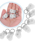 Thirty Pack Of Heavy Duty Double Wheel Curtain Track Rollers Made To Slide Like Butter On Overhead Ceiling Pulleys in hand.