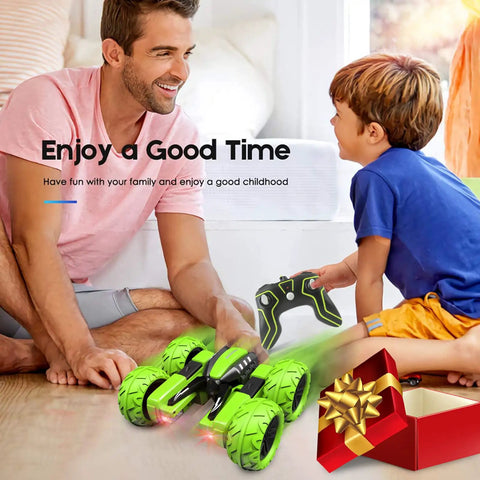Kid-Friendly Offroad RC Car with Headlights and Dual-Sided Stunts, 4WD Power, played by father and son indoors near gift box