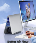 Vertical Laptop Stand For Desk With Dual Slots Space Saving 4 In 1 Design Adjustable Width Laptop Organizer shown holding laptop