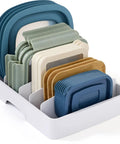 Big Kitchen Cabinet Lid Organizer With Five Adjustable Dividers showing assorted lids in a white organizer tray.