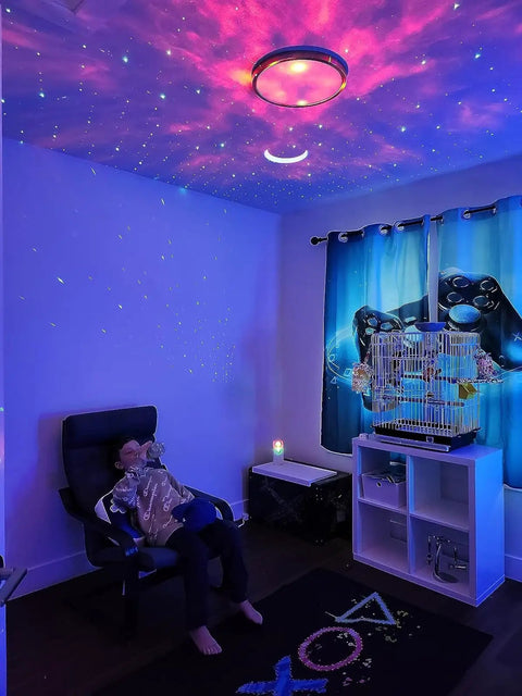 Galaxy Star Projector With Bluetooth Speaker lit night light illuminating a room with nebula clouds and starry sky for kids.