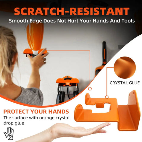 Heavy Duty Weedeater Wall Hanger Rack for Trimmers in use, orange coated steel, mounted on wall, shows person adjusting tool