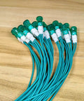 20 Pack Green LED Indicator Lights 10mm Dope Energy Saving LEDs For AC DC 12 24V 0.5W with wires on wooden surface