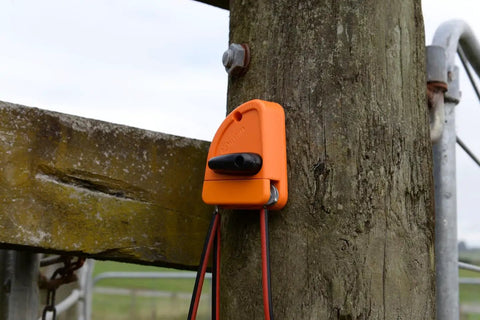 Electric Fence Cutout Switch For Quick Power Control In Outdoor Fencing Systems Pro Grade Rugged Build For Harsh Weather Easy Install mounted on wooden post