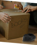 Rock Solid Heavy Duty Tape Dispenser Cutter With Ergonomic Grip and Sharp Steel Blade for 5 cm packing tape used to seal a box.