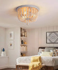 Wood Beaded Chandelier 3 Light Semi Flush Mount Boho Farmhouse Ceiling Light In Oak White Finish in cozy bedroom setting.