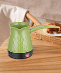 Front view of Electric Turkish Coffee Pot 500ml Water Kettle with Handle Fast Heating 600W shown on a table