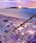 Stainless Steel Garden Claw Rake With Extendable Aluminum Handle for quick weeding on a pebble beach at sunset, reach 49 inch.