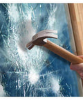 Clear Window Security Film Adhesive 2 Mil Anti Shatter UV Blocking Shield for Home and Office on shattered glass with hammer