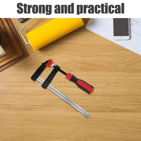 Heavy Duty 6 Inch F Clamp With Quick Adjustment And Antirust Finish For Welding Projects and Workshop Environments Featuring One Hand Operation, on a wooden surface.