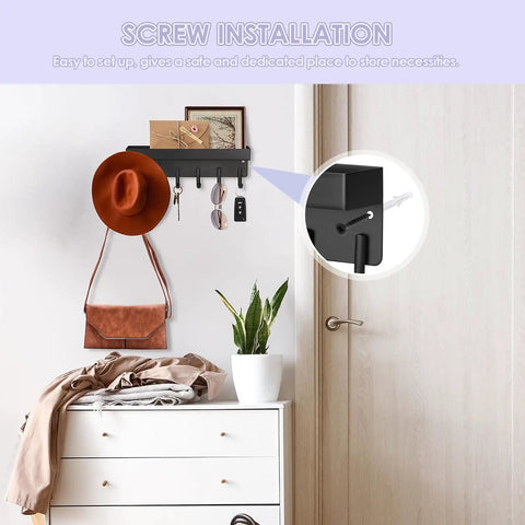 Compact Wall Mount Key Holder With Tray And Six Hooks Black Finish Easy Two Mount Options With Adhesive Tape Or Screws Durable Key Organizer For Entryway Or Kitchen That Keeps Keys And Small Accessories In Check And Ready To Grab installed above dresser with hats and keys, showing screw installation.