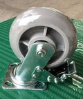 Badass Heavy Duty Silent Rubber Caster Wheels With Fixed Industrial Brakes mounted on a sturdy base, showcasing robust design and durable materials.