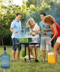 Group enjoying BBQ with a 5 Gallon Electric Water Dispenser Pump For 2 To 5 Gallon Jugs, USB Rechargeable Water Bottle Pump on patio.