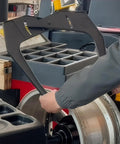 Person using Nyutcwe Wheel Rim Measuring Tool, ABS Tire Width Gauge to measure rim on vehicle.