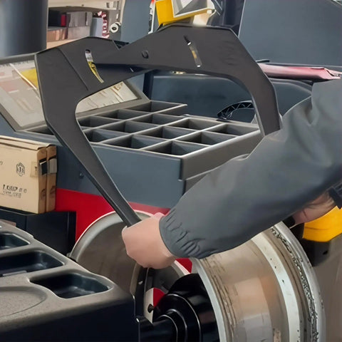 Person using Nyutcwe Wheel Rim Measuring Tool, ABS Tire Width Gauge to measure rim on vehicle.